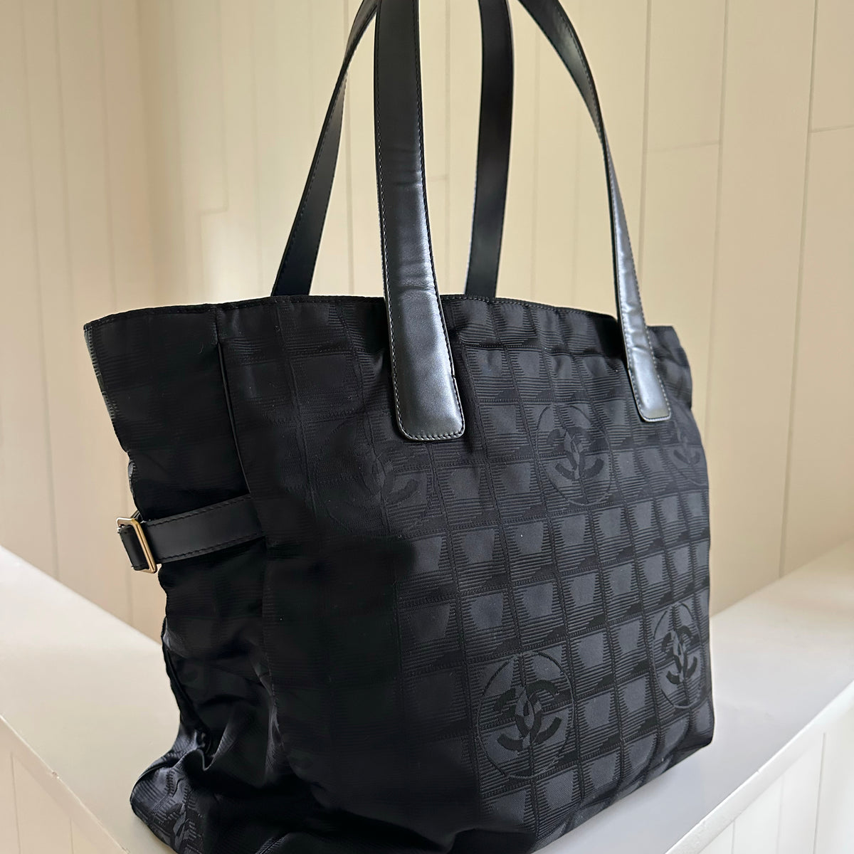 chanel tote travel bag Pre-loved Line owned The New Travel Line tote bag features a nylon body with leather trim Chanel Travel Line CC Tote